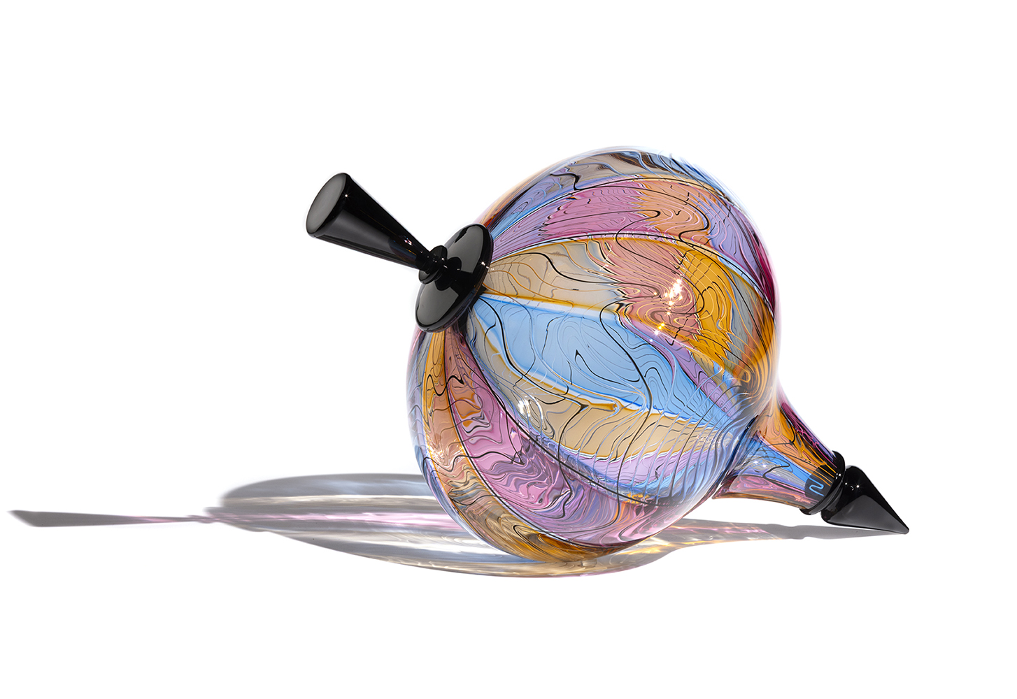 Glass spinning top with black handle and point