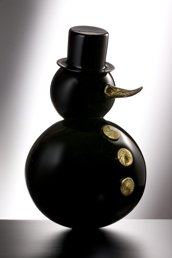 black glass snowman with top hat and gold buttons and nose