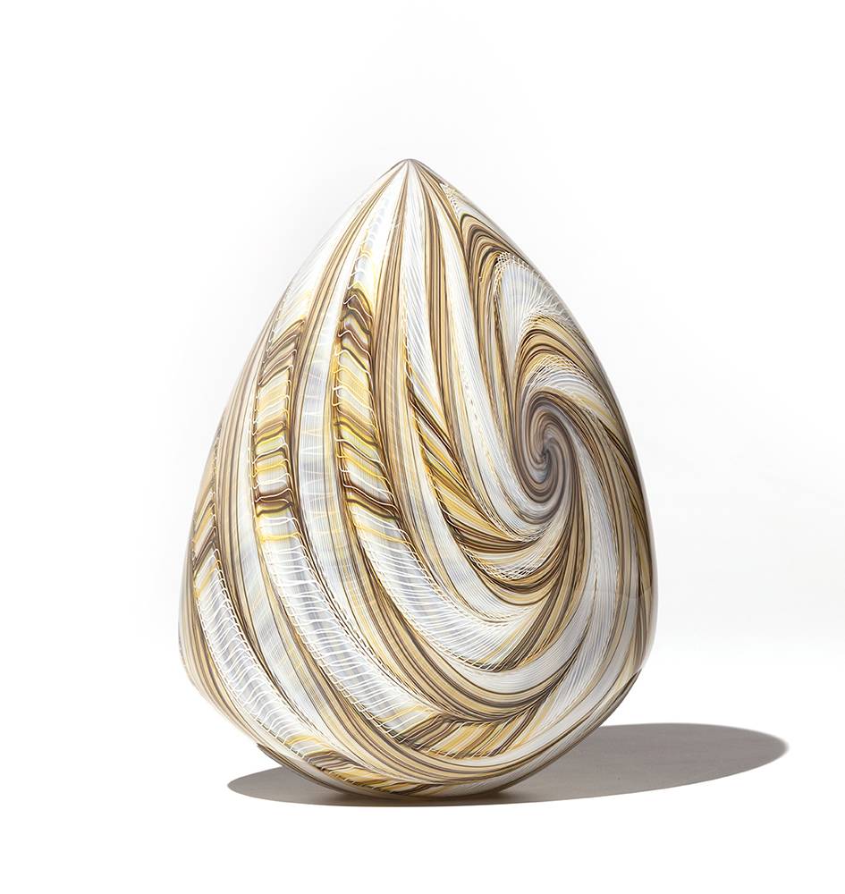 White, gold and brown glass sculpture with swirled pattern