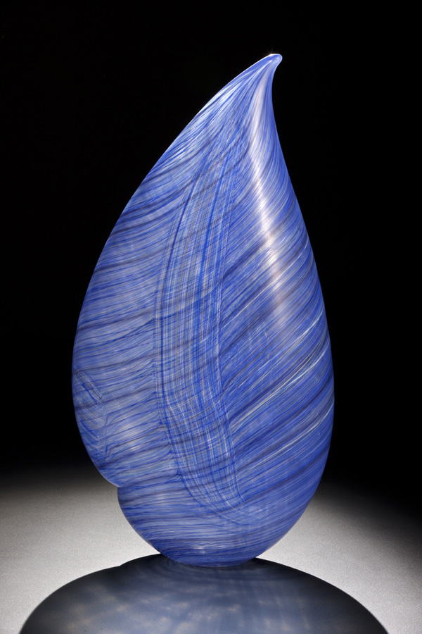 blue glass sculpture with delicate linear pattern