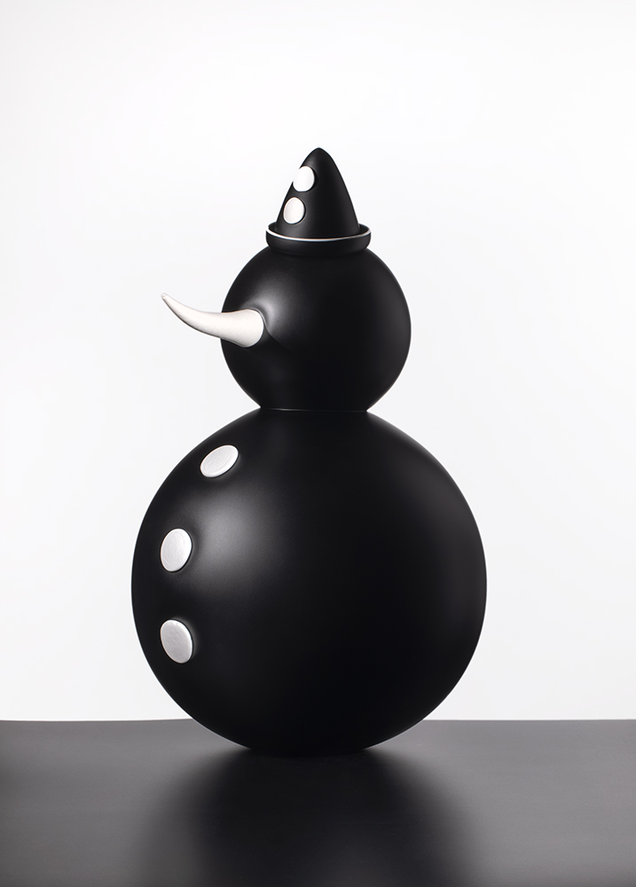 black glass snowman with white buttons and conical hat