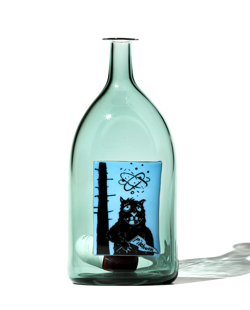 transparent blue glass bottle with image of woodchuck