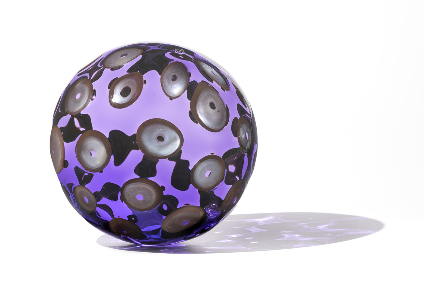 Purple glass sculpture with silver dots