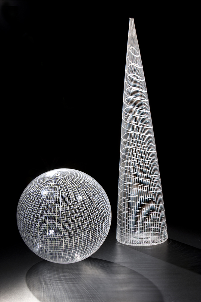transparent glass orb and cone with delicate white patterns