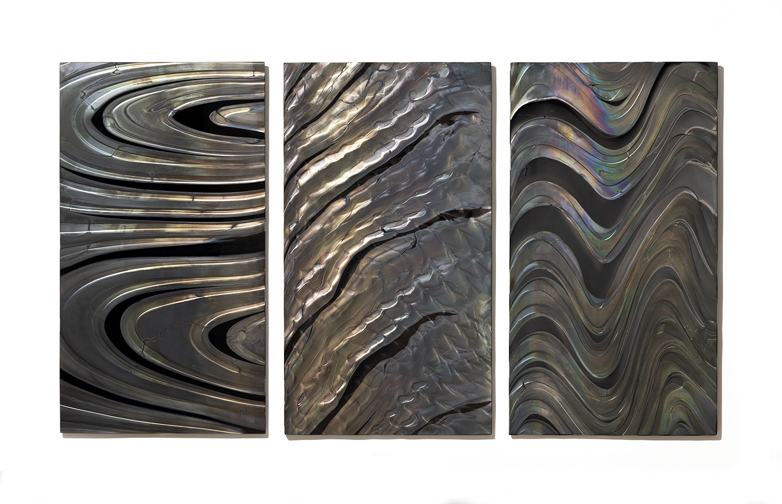 trio of black glass panels with metallic silver patterns