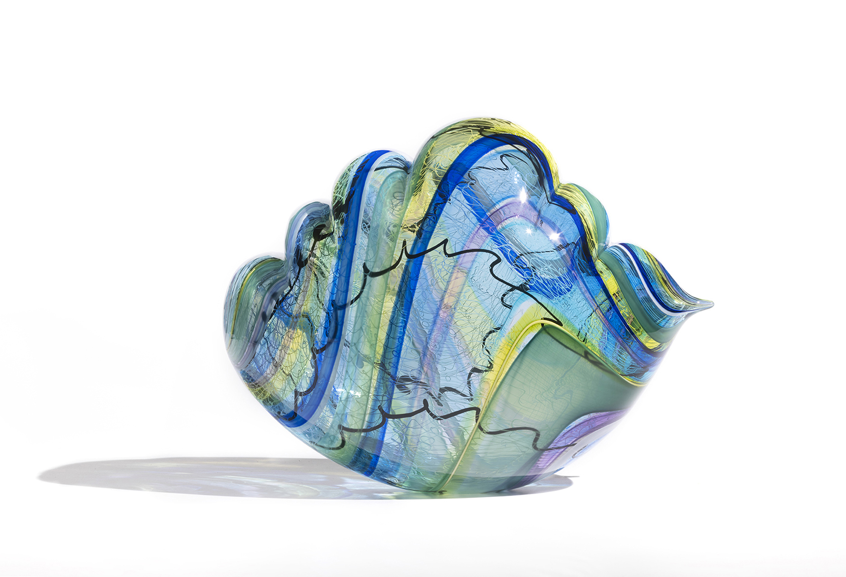 Glass sculpure in cloud shape with blue, lime and green wavy stripes