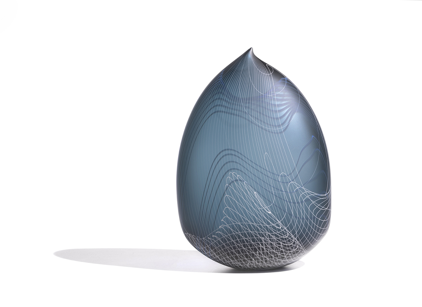 steel blue glass sculpture with delicate white and blue lines