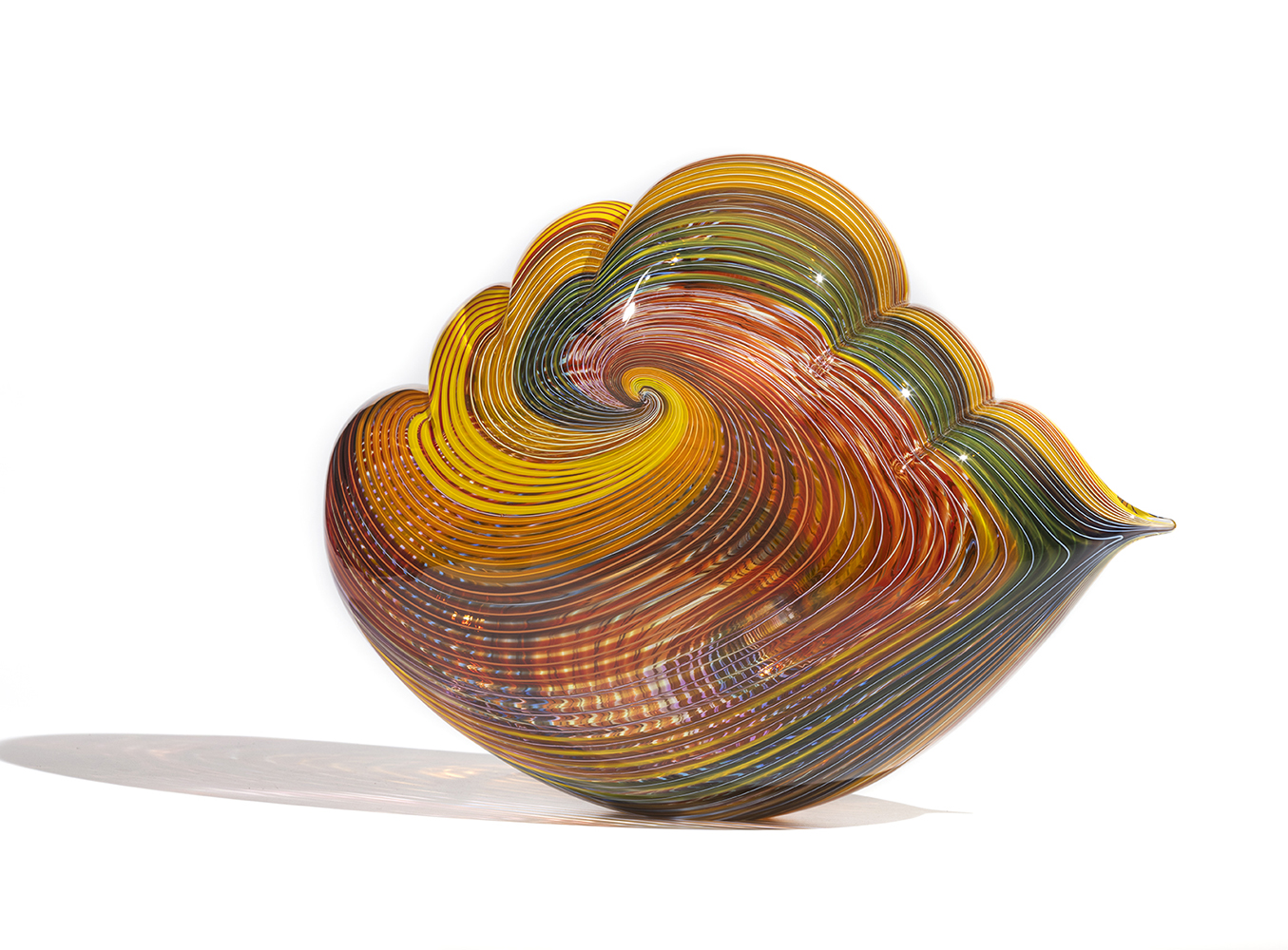 glass cloud sculpture with warm toned line pattern in a spiral shape